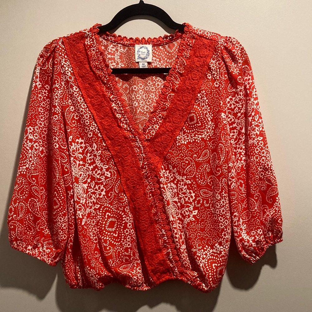 Francesca’s red top